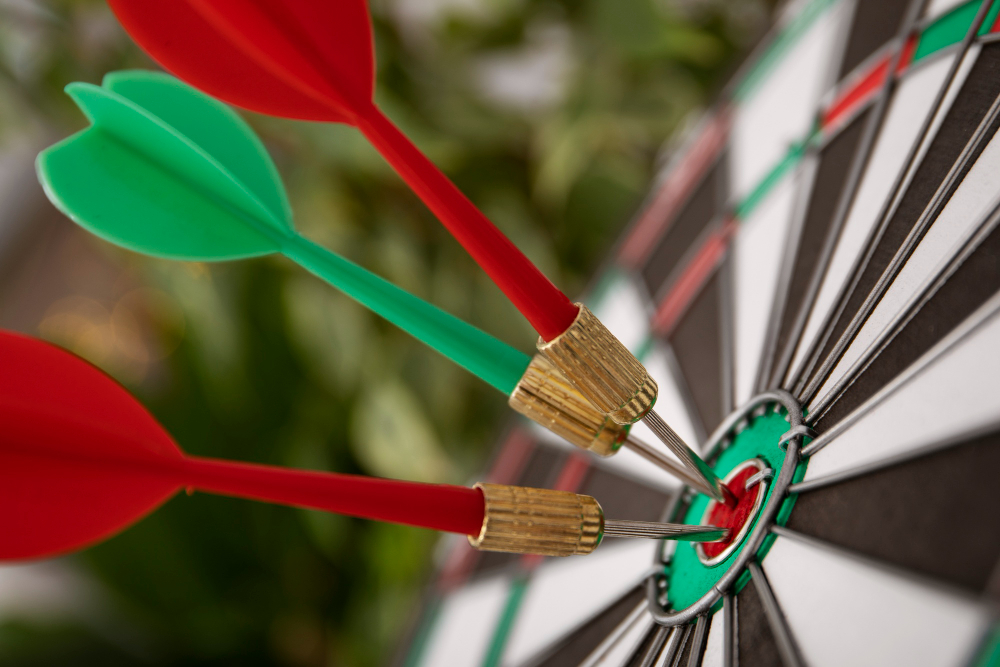 view dartboard with bullseye arrow points The Joy of Health